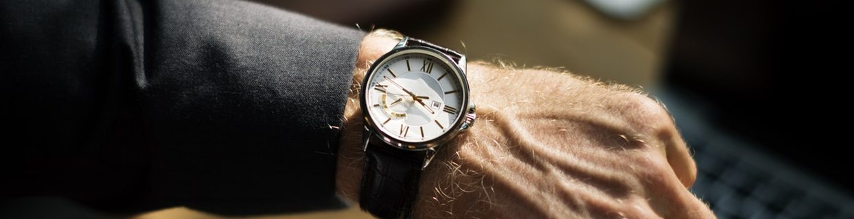 Business suit arm with a watch