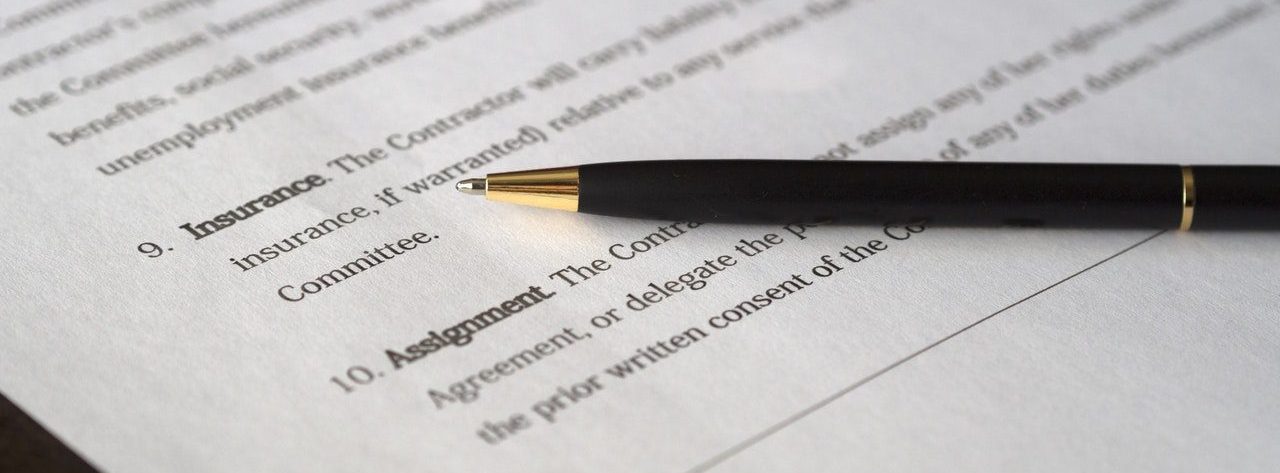 Legal agreement with black pen