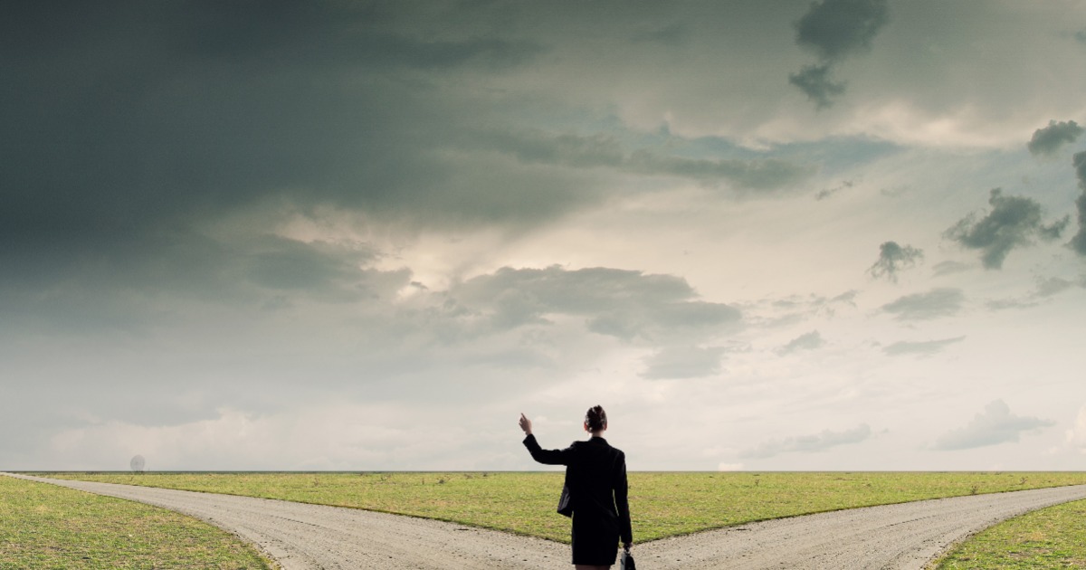 business women deciding two roads to take
