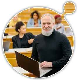 Professor in the class holding the open laptop open - Moodle Multitenancy